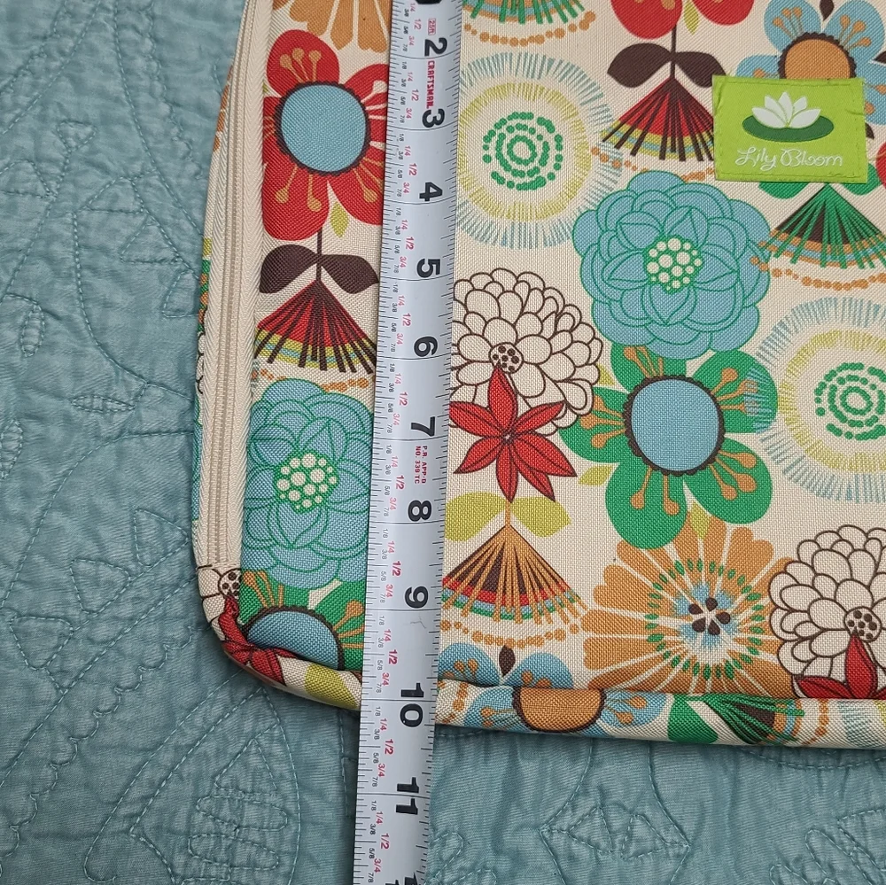 Lily Bloom Red and Blue Laptop Bag with Whimsical Floral Design